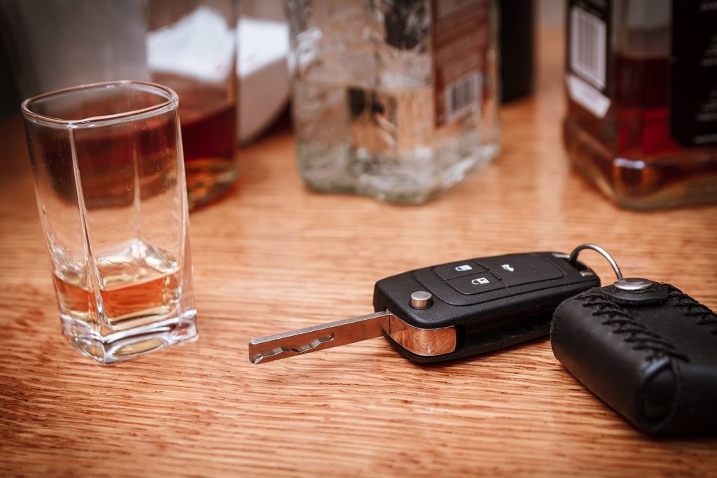 Alcohol and car key on the table
