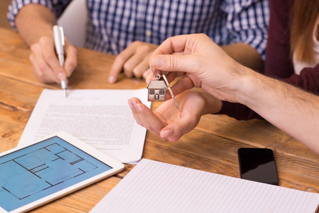 Man signing a property contract