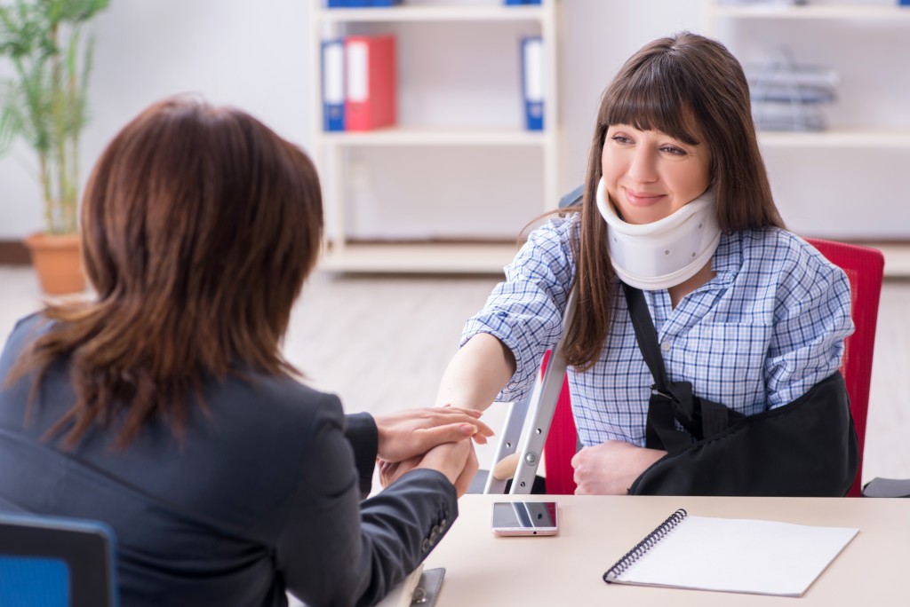 Injured client consulting a lawyer