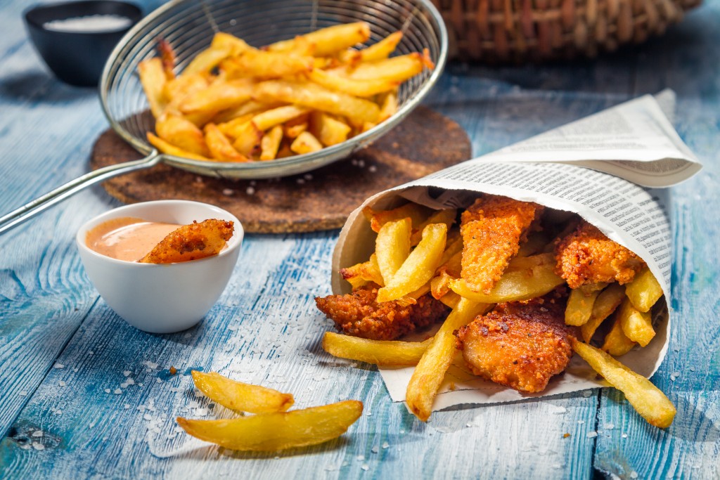 fish and chips on a wooden table