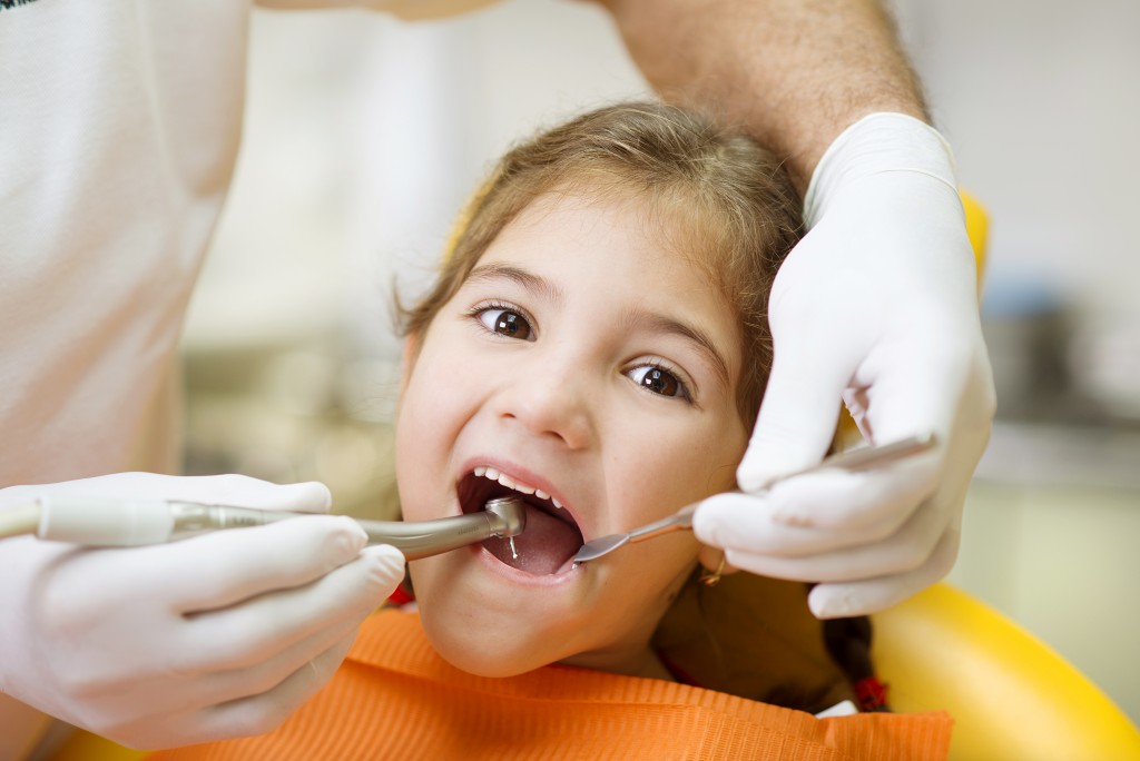 Girl having her dental check up