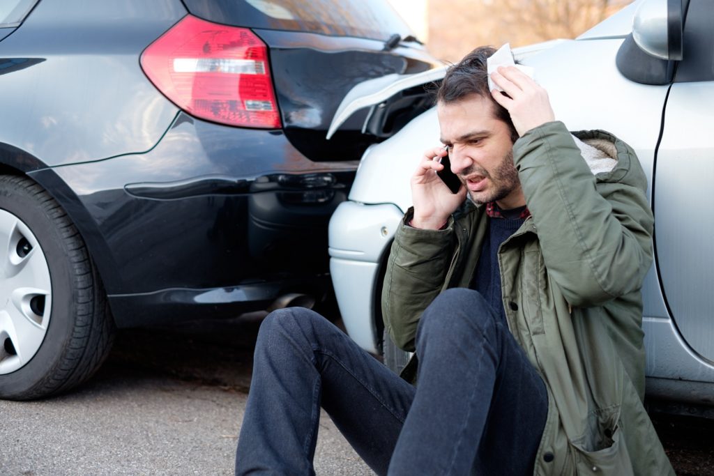 man calling his attorney or lawyer after an incident