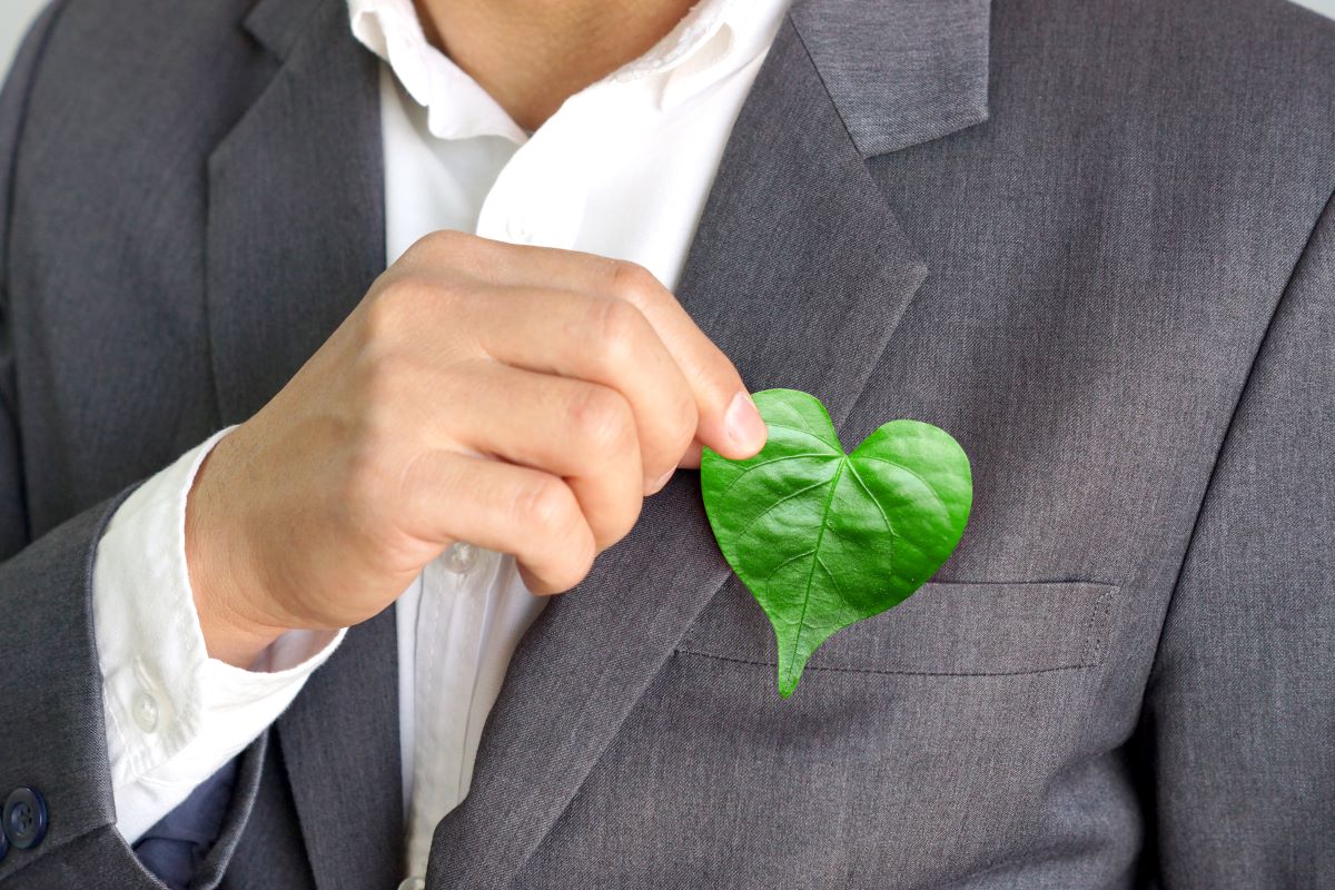 man holding heart shaped leaf