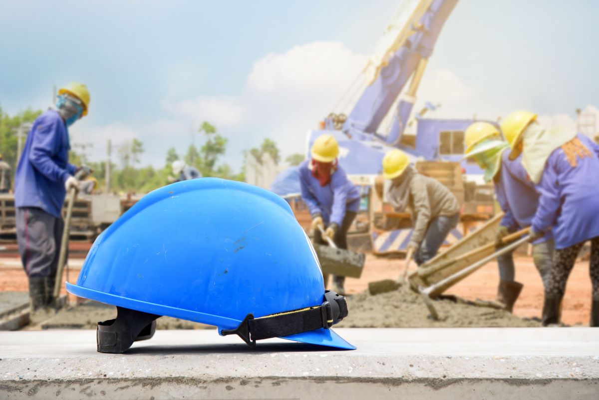 hard hat with construction in the background