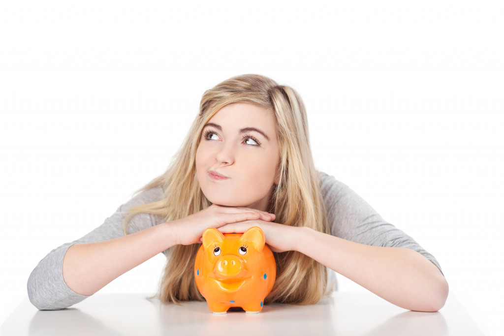 woman and piggybank