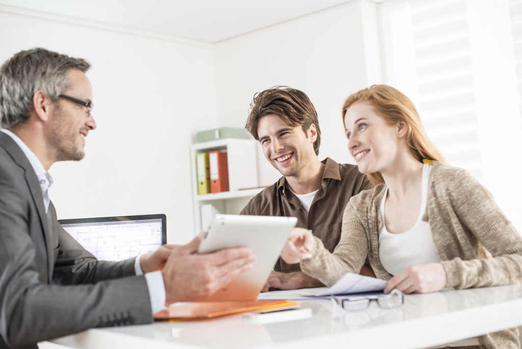 real estate agent discussing with his client