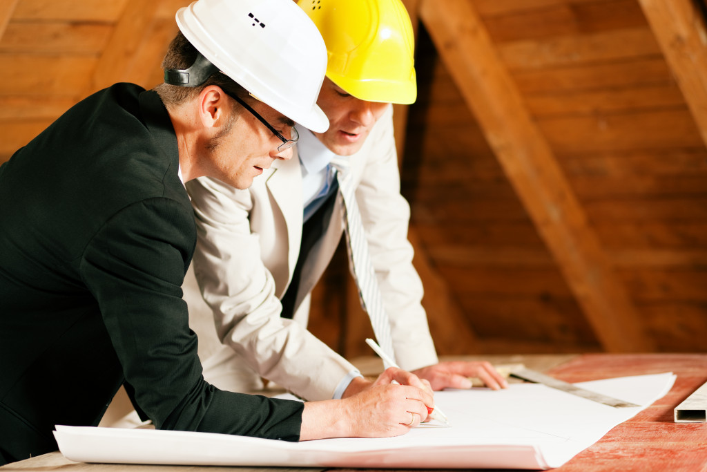 contractors drafting a blueprint