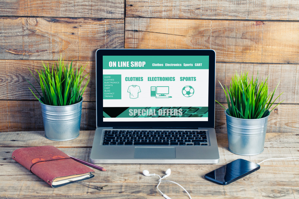 e-commerce site in green hue displayed on a laptop screen