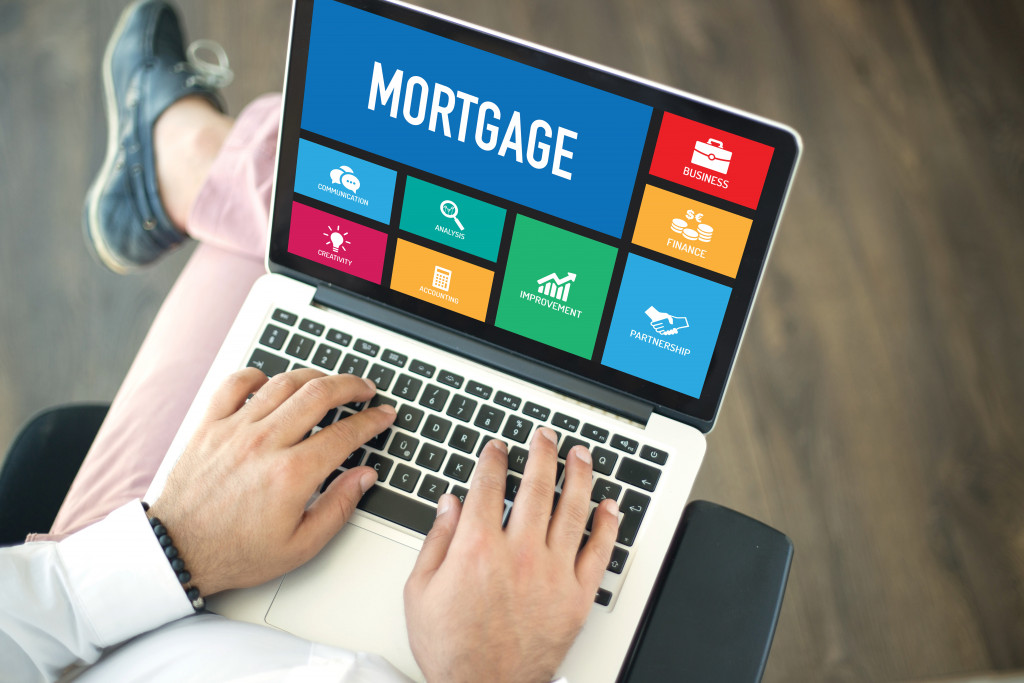 a man using laptop to check mortgage