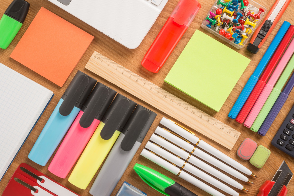 a portrait of office supplies scattered on a desk