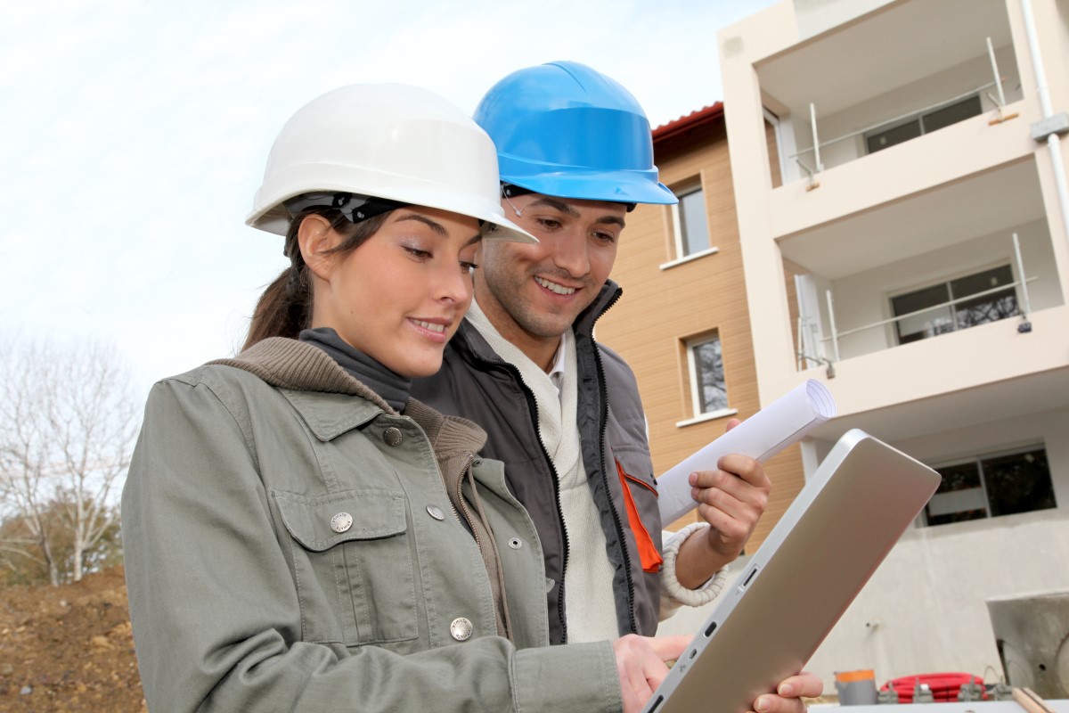 man and woman in a construciton site