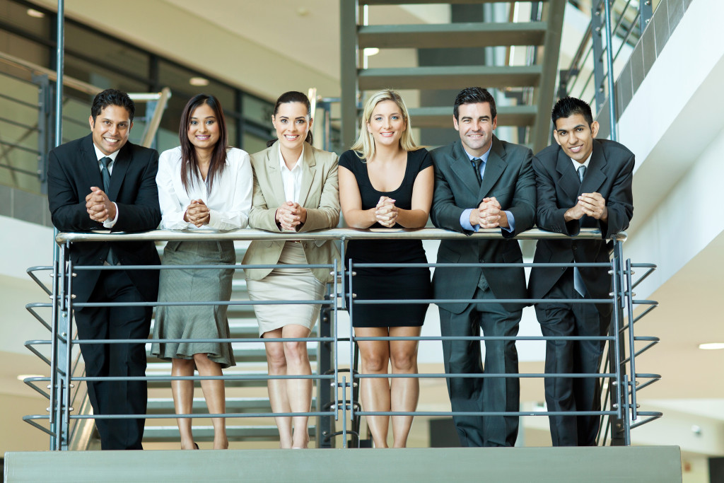 A diverse group of young business professionals on the stairs