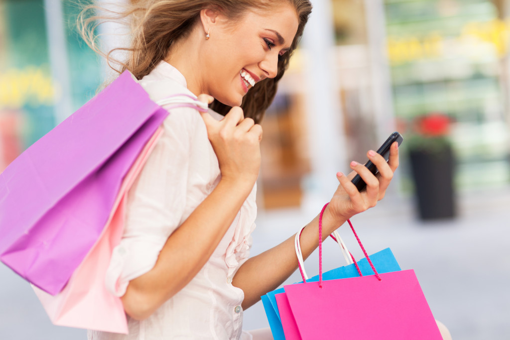 young woman with shopping bags