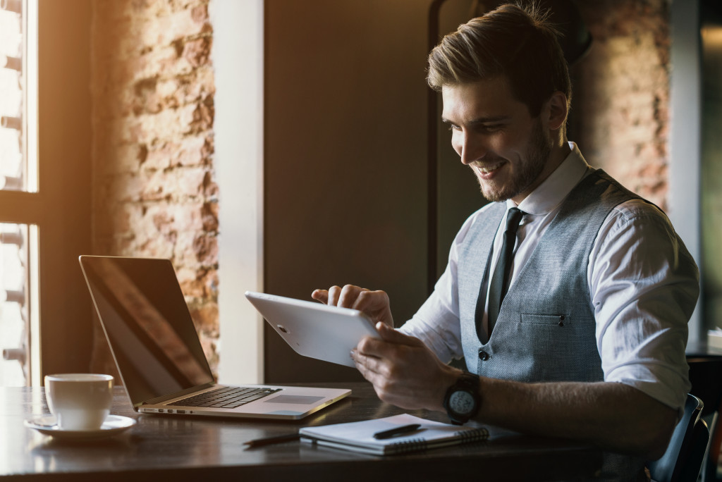 Businessman uses tablet