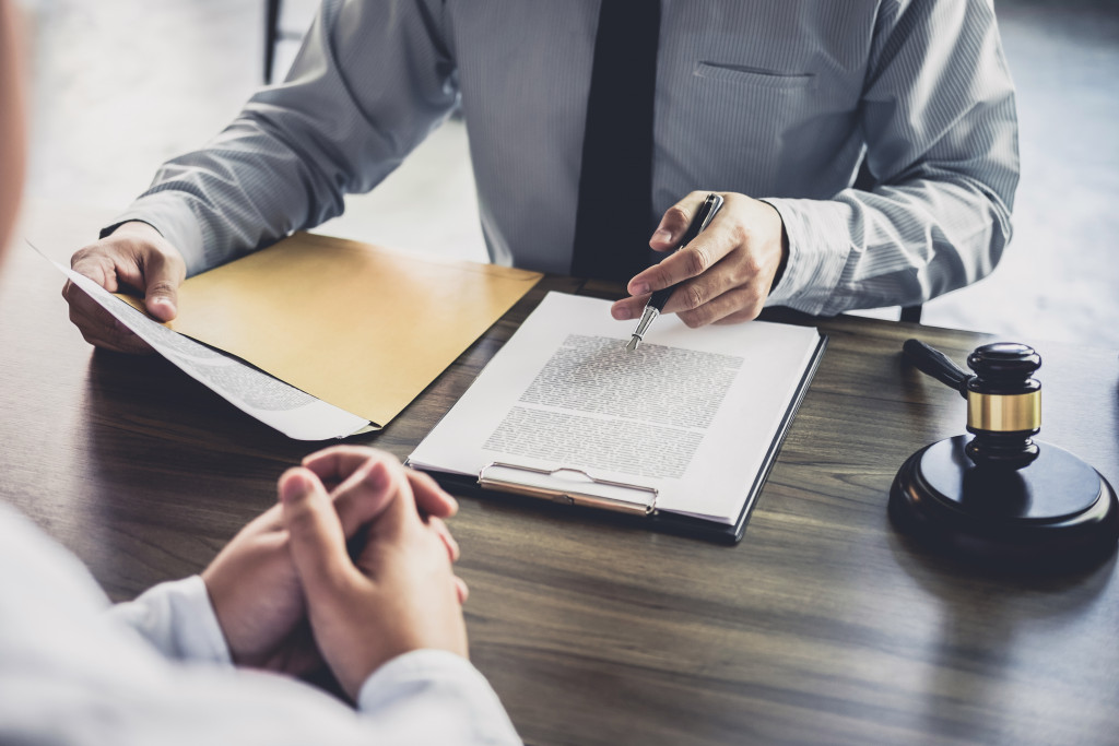 a person discussing insurance with a lawyer