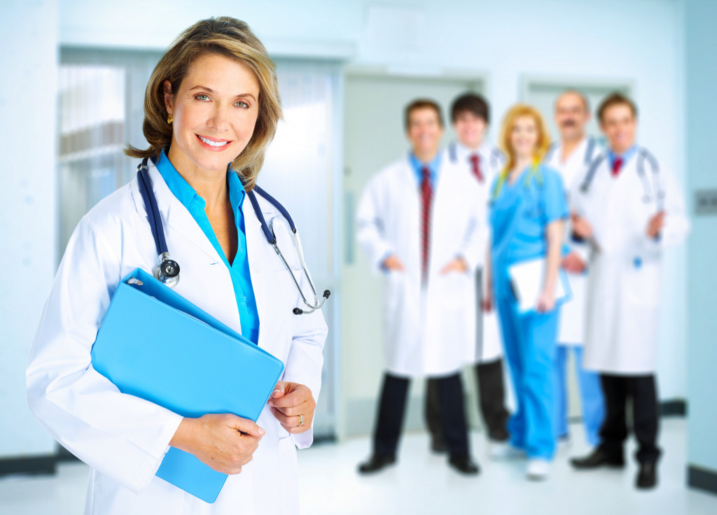 Smiling family doctor woman with stethoscope