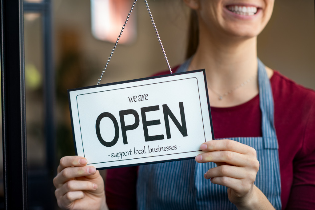 woman opening her shop