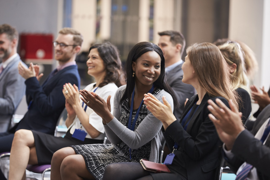 female employees clapping