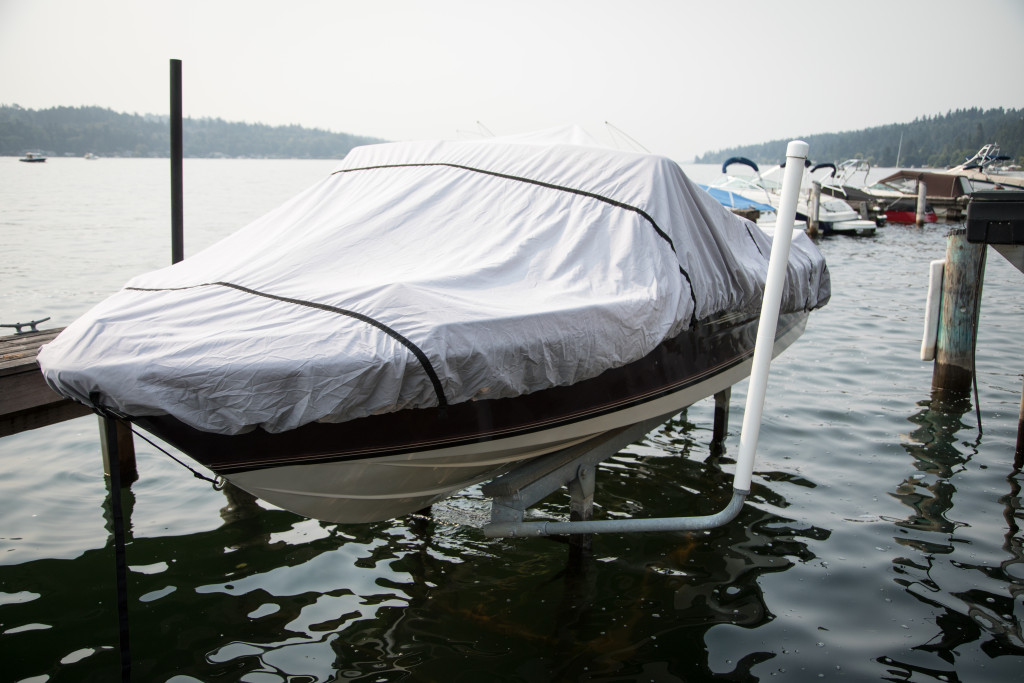 motorboat covered in rain tarp