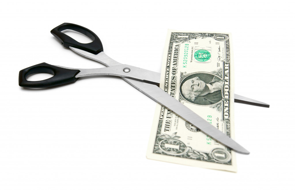 Money between scissor blades