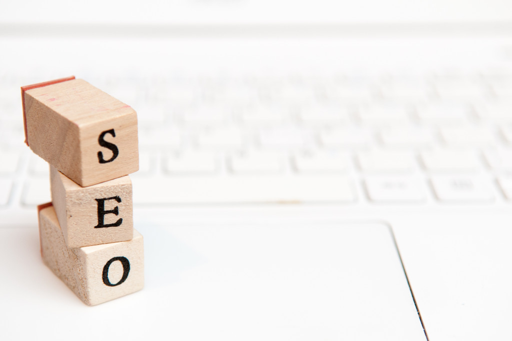 SEO wooden blocks on laptop keyboard