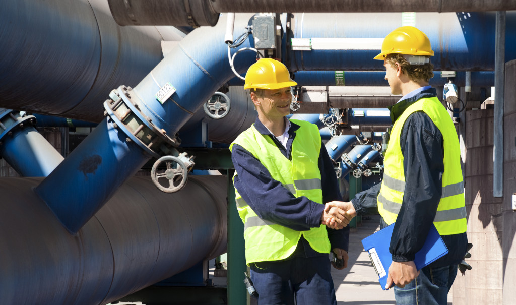 man shaking hands with another man